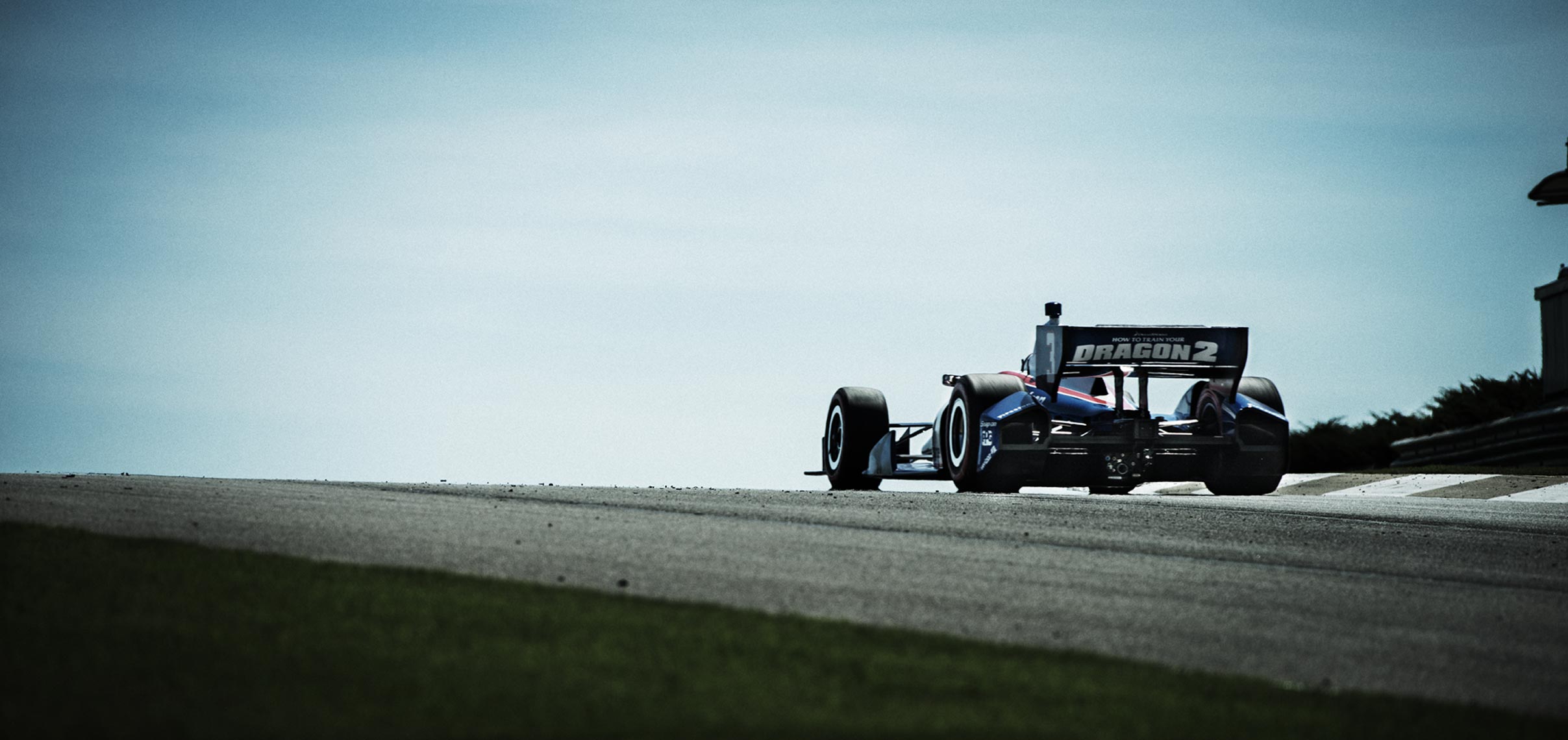 Helio Castroneves climbing a hill at Barber
